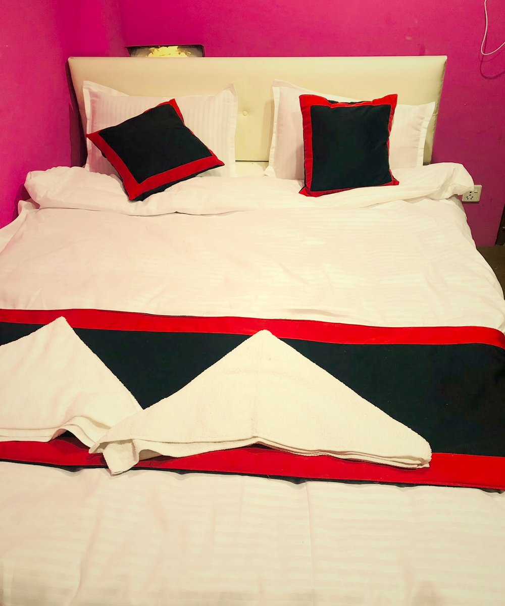 Freshly made bed with pressed linen